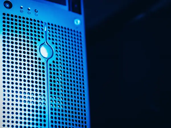 A server rack lit in deep blue