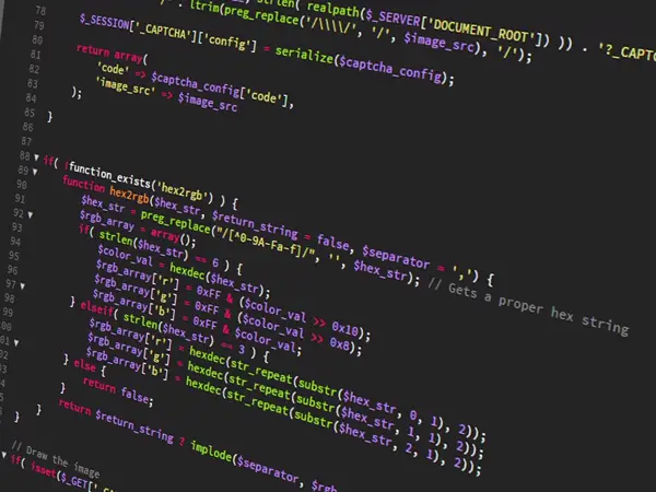 Colourful source code on a dark screen, filling the frame